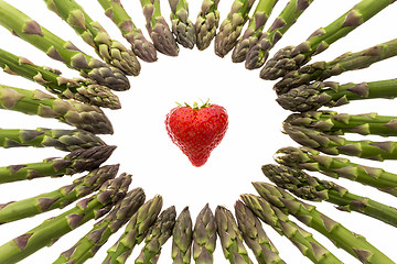 Image showing Circle Of Asparagus Tips Pointing At Strawberry\r