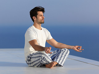 Image showing young man practicing yoga