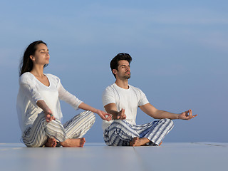 Image showing young couple practicing yoga