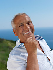 Image showing senior man sitting outside