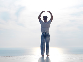 Image showing young man practicing yoga