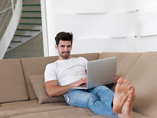 Image showing Man Relaxing On Sofa With Laptop