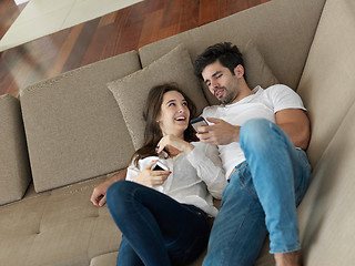 Image showing young couple making selfie together at home