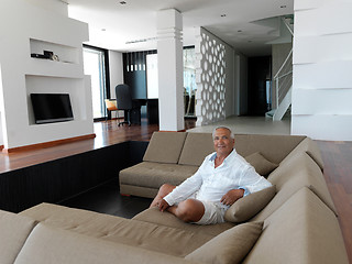 Image showing Portrait of senior man relaxing in sofa