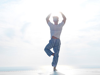 Image showing young man practicing yoga