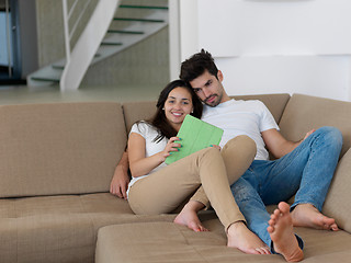 Image showing young couple making selfie together at home