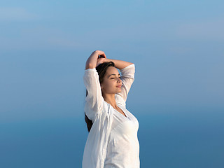 Image showing young woman enjoy sunset