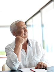 Image showing Portrait of senior man relaxing in sofa