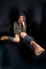 Image showing Portrait of young pretty woman in boots