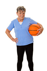 Image showing Senior woman carrying a basketball