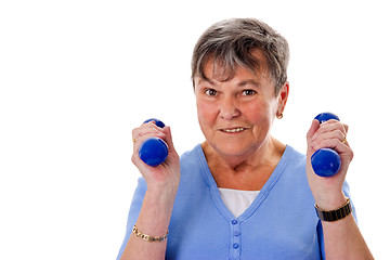 Image showing Elderly woman exercising with dumbbells