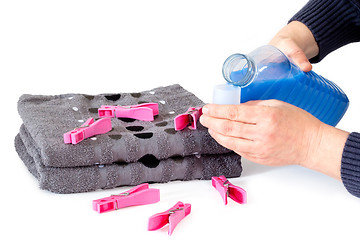 Image showing Applying fabric softener