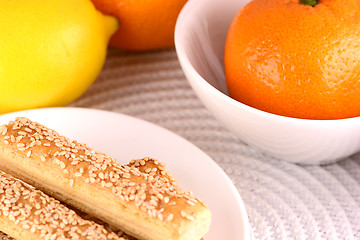 Image showing sweet cake on white plate and fruits