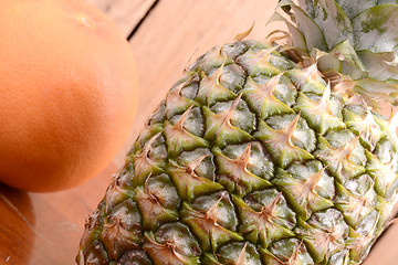 Image showing fresh pineapple with orange