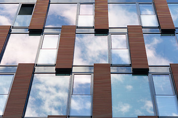 Image showing Blue sky reflected in mirror windows of modern office building