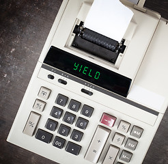 Image showing Old calculator - yield