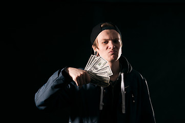 Image showing  young man with money in his hands