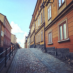 Image showing Cobblestone street with old buildings in Stockholm