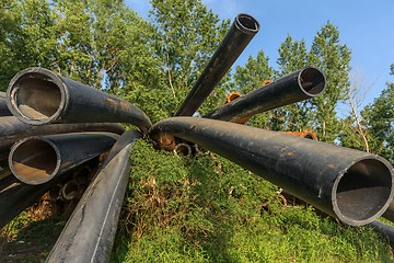 Image showing Rusty metal pipes in the forest