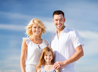 Image showing happy family with blue sky