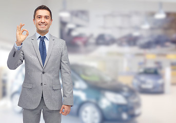 Image showing happy man at auto show or car salon