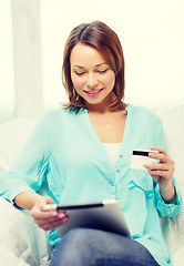 Image showing smiling woman with tablet pc computer at home