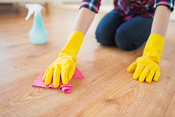 Image showing close up of woman with rag cleaning floor at home