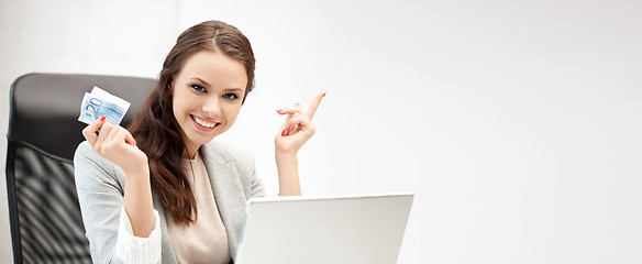 Image showing happy woman with computer and euro cash money