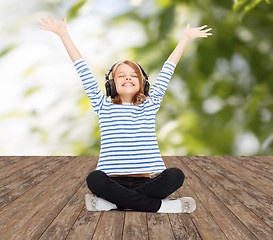 Image showing happy girl with headphones listening to music