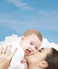 Image showing laughing baby playing with mother