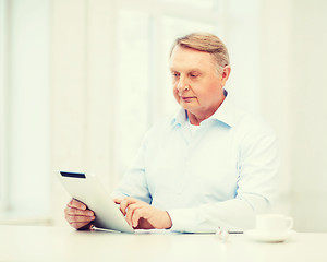 Image showing old man with tablet pc computer at home