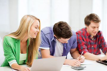 Image showing students writing test or exam in lecture at school