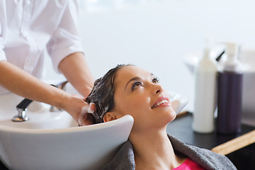 Image showing happy young woman at hair salon