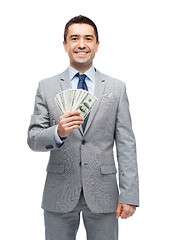 Image showing smiling businessman with american dollar money