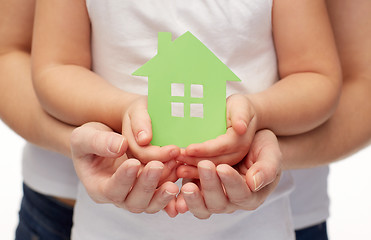 Image showing close up of woman and girl hands with paper house