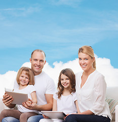 Image showing happy family with tablet pc computers