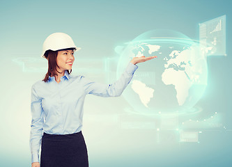 Image showing young smiling businesswoman in white helmet