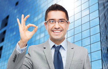 Image showing happy smiling businessman in eyeglasses and suit