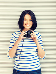 Image showing happy teenage girl in big headphones