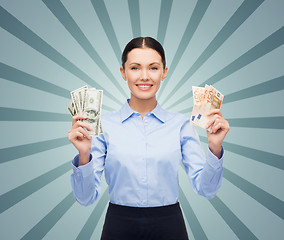 Image showing businesswoman with dollar and euro cash money