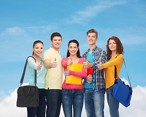 Image showing group of smiling teenagers showing thumbs up