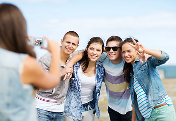 Image showing teenagers taking photo outside