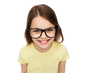 Image showing smiling cute little girl in black eyeglasses