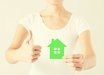 Image showing woman hands holding green house