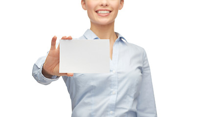 Image showing smiling businesswoman showing white blank card