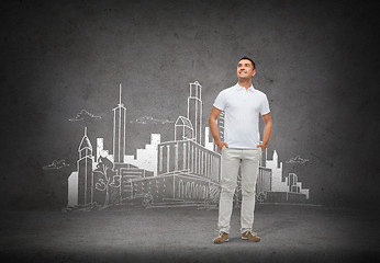 Image showing smiling man over city sketch background