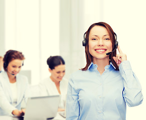 Image showing friendly female helpline operator at office