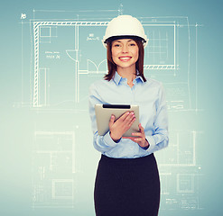 Image showing young smiling businesswoman in white helmet