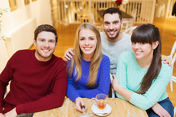 Image showing group of friends taking picture with selfie stick