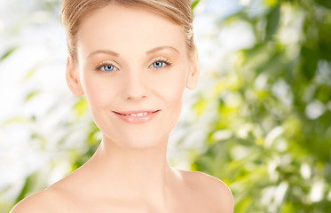 Image showing beautiful young woman face over green background